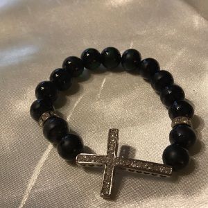 Black beads; silver cross; stretchy bracelet